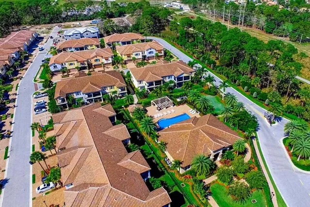 a kitchen with stainless steel appliances granite countertop a refrigerator and a stove