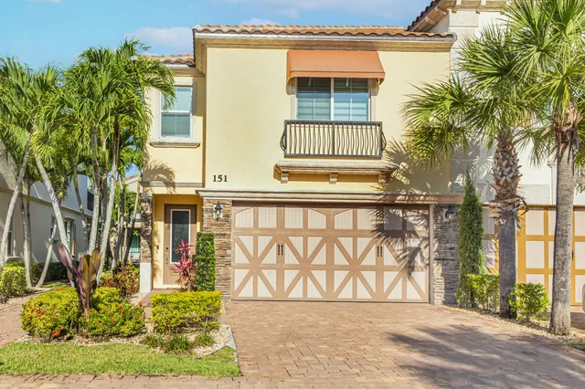 a view of a balcony with lake view and a potted plant