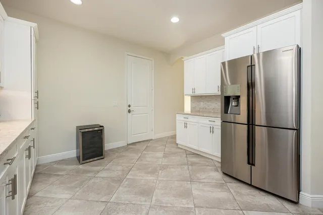 a bedroom with a bed and a night stand