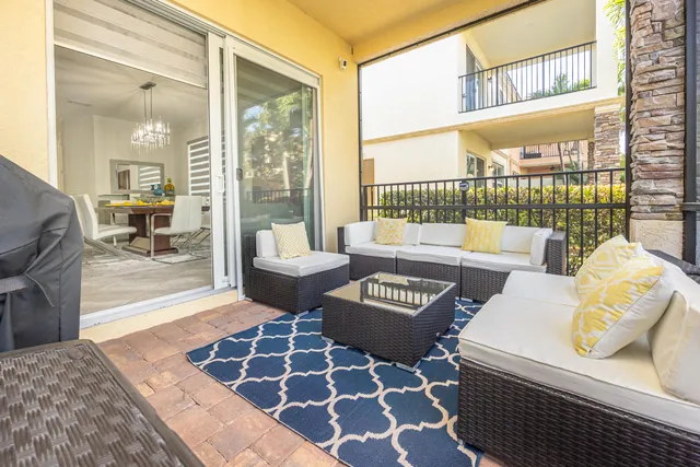 a bedroom with a bed a flat screen tv and cabinets