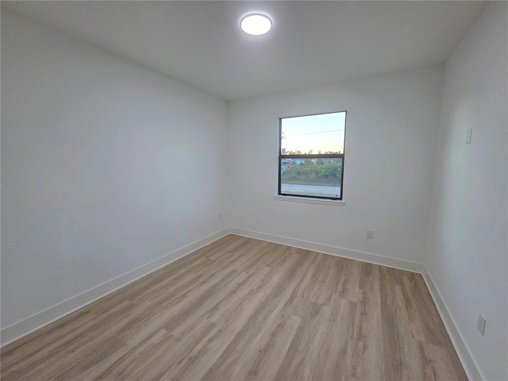 2967 Barry Road North Port, FL 34286 - Photo 13 of 16 an empty room with a window