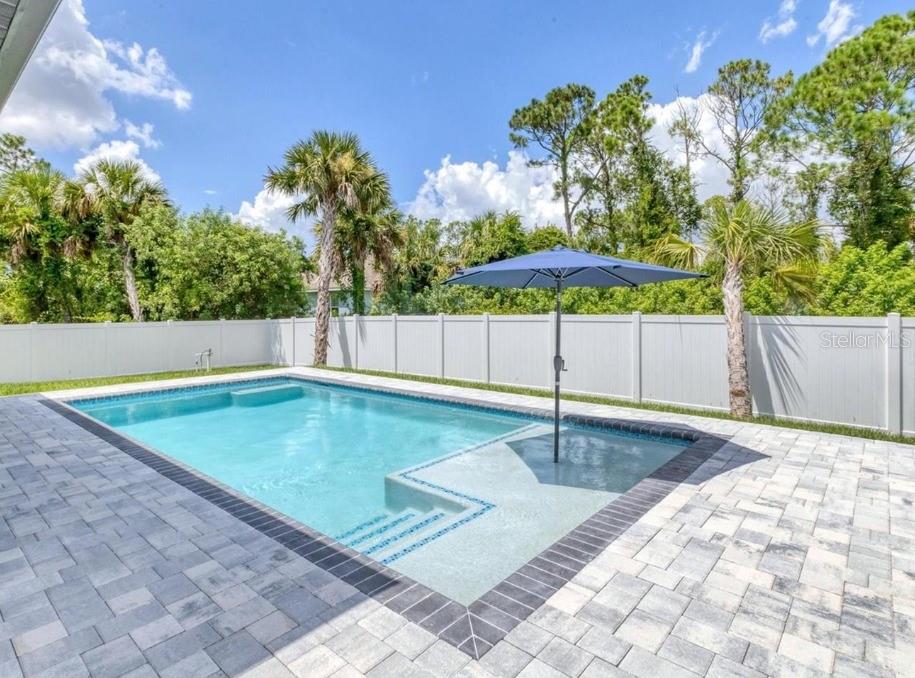 2967 Barry Road North Port, FL 34286 - Photo 4 of 16 a backyard of a house with table and chairs
