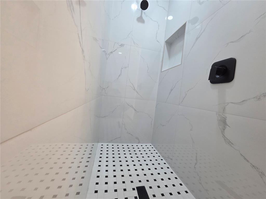 2967 Barry Road North Port, FL 34286 - Photo 10 of 16 a bathroom with a shower