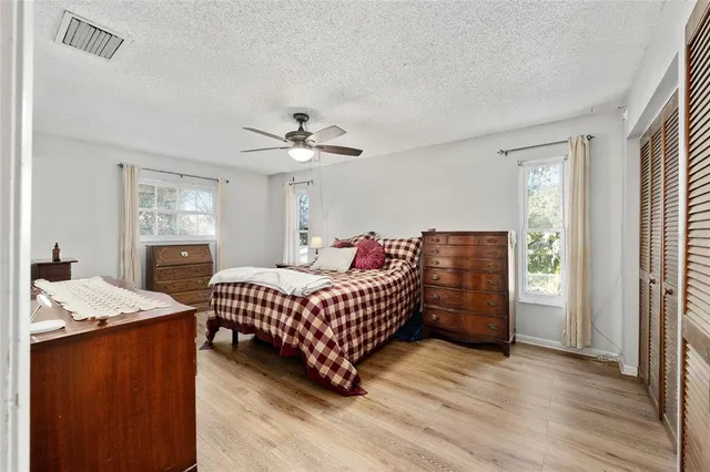 a bedroom with furniture and window