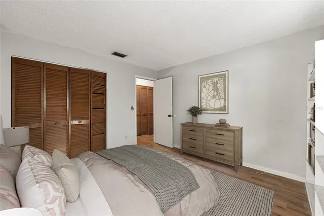 a bedroom with a bed and a dresser