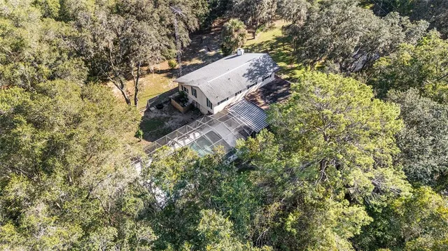 an aerial view of a house with yard and outdoor space