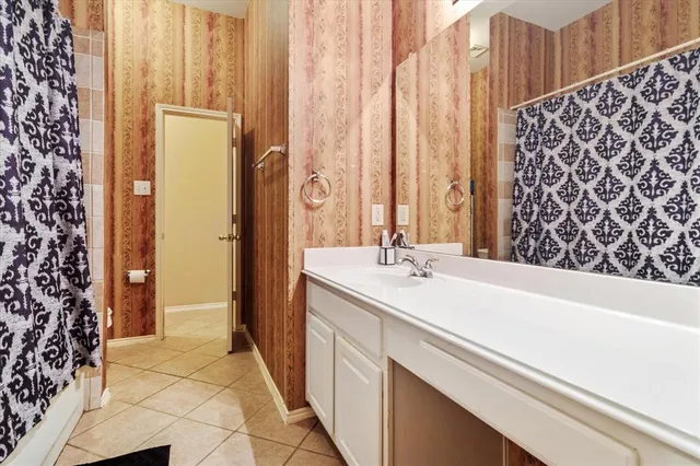 a bathroom with a sink and a shower