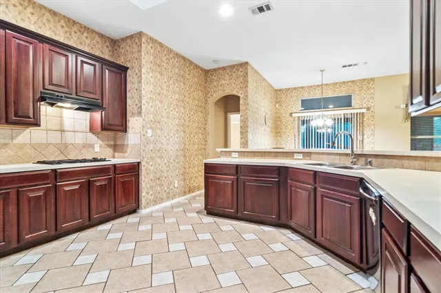 a spacious bathroom with a granite countertop sink and a mirror