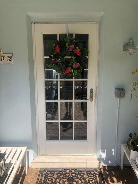 741 Hummingbird Way, Unit 8 North Palm Beach, FL 33408 - Photo 3 of 13 a view of a entryway