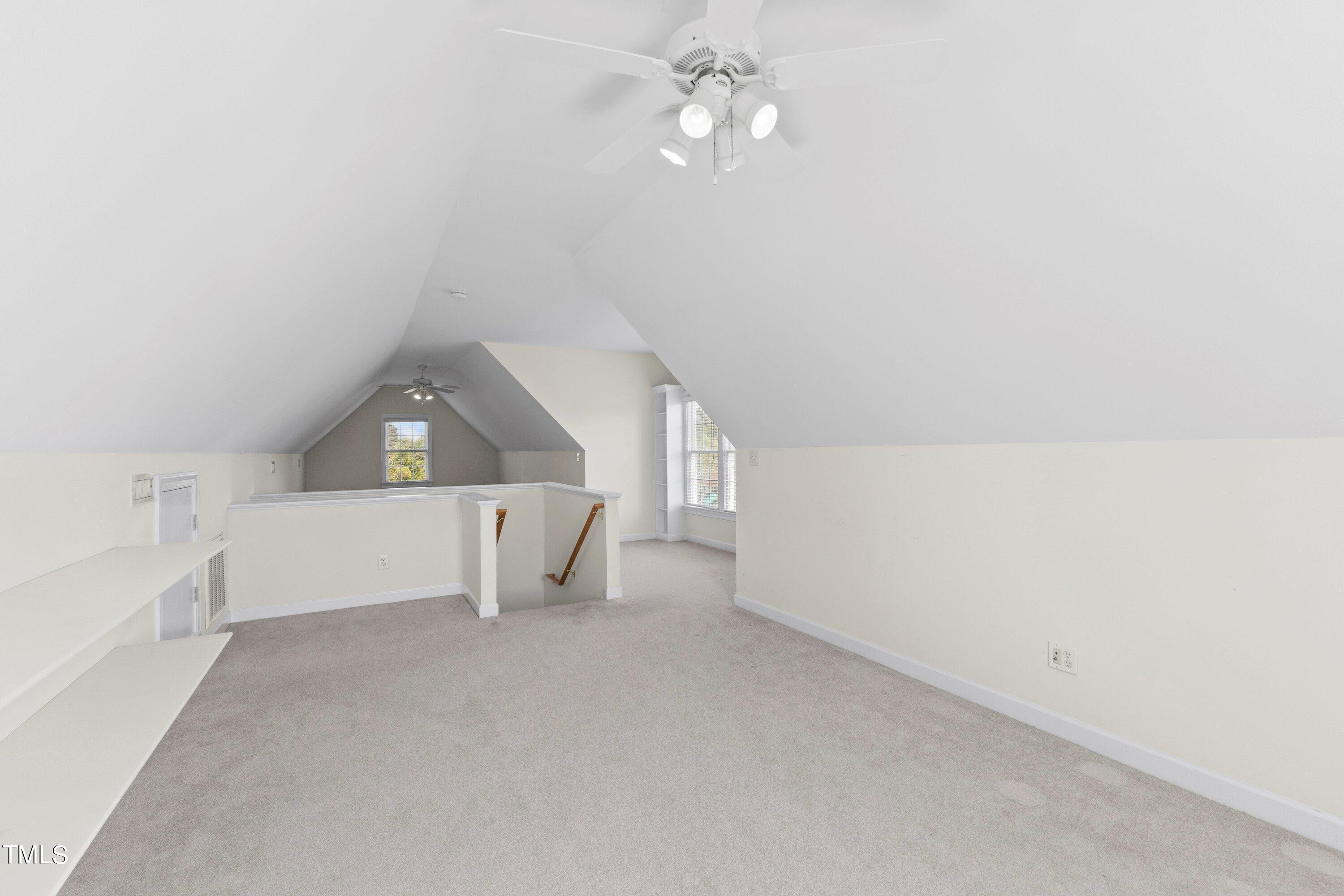 1004 Pasture View Lane Raleigh, NC 27603 - Photo 35 of 48 an empty room with a ceiling fan and a window