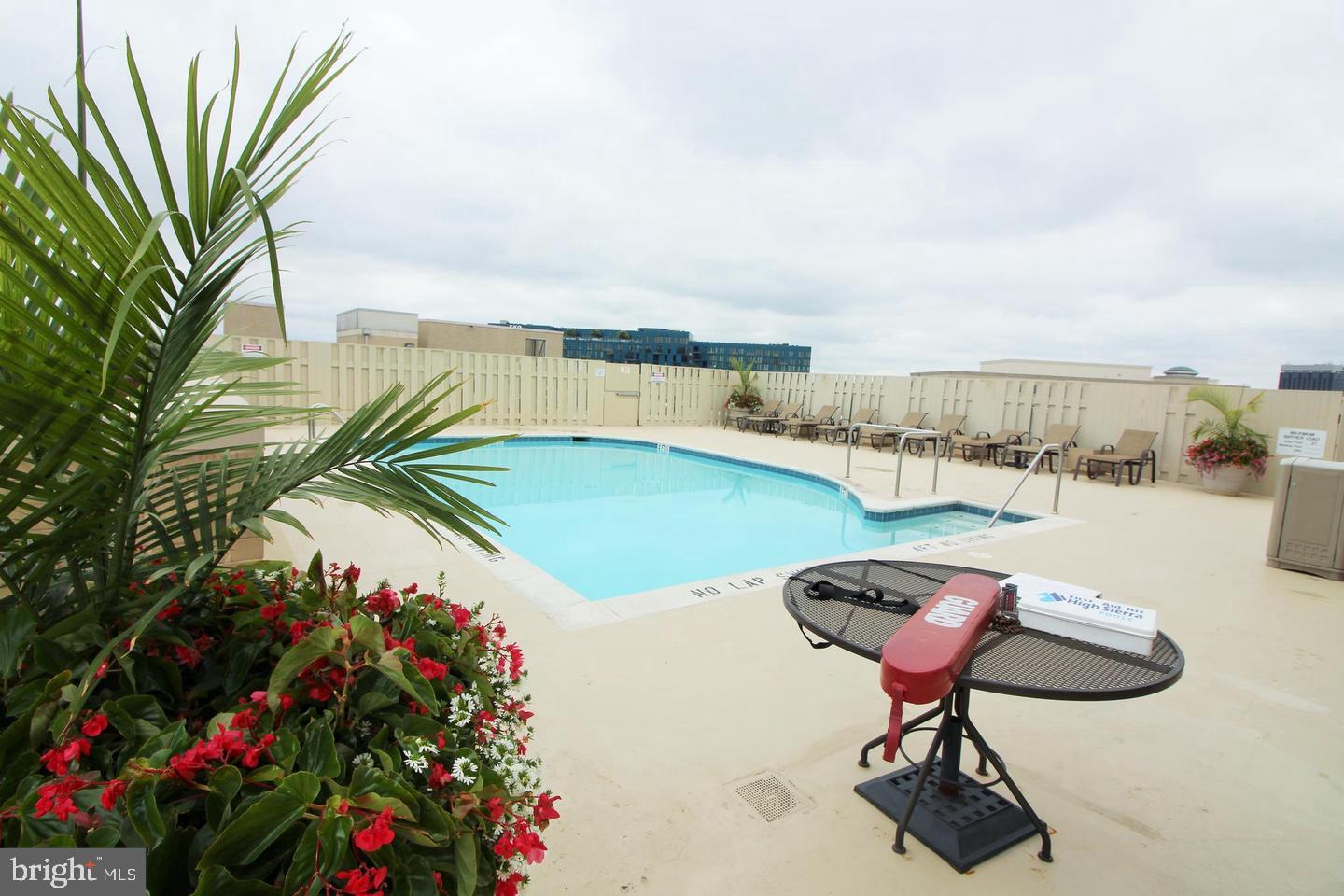 11800 Sunset Hills Road, Unit 625 Reston, VA 20190 - Photo 12 of 19 a view of swimming pool with seating space