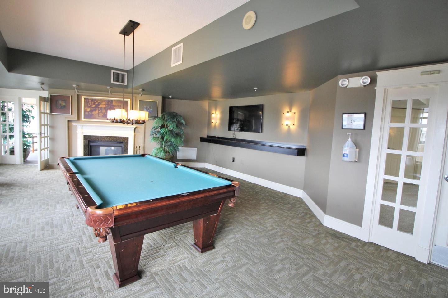 11800 Sunset Hills Road, Unit 625 Reston, VA 20190 - Photo 19 of 19 a room with pool table and windows