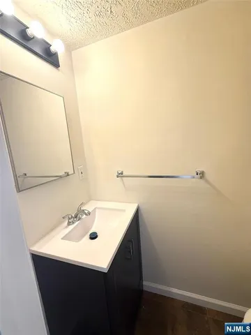 a white toilet sitting next to a shower