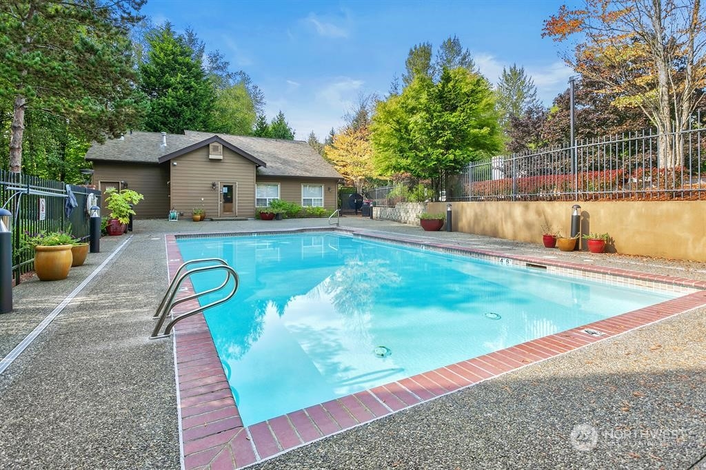 18930 Bothell Everett Highway, Unit J105 Bothell, WA 98012 - Photo 19 of 21 swimming pool view with a seating space and garden view