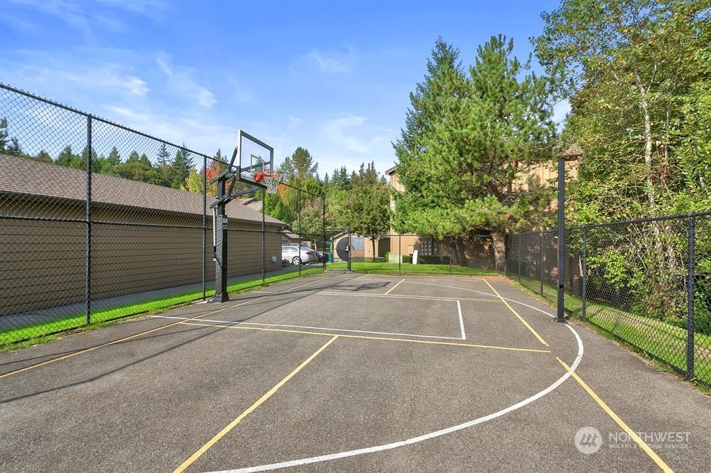 18930 Bothell Everett Highway, Unit J105 Bothell, WA 98012 - Photo 20 of 21 a view of a tennis court