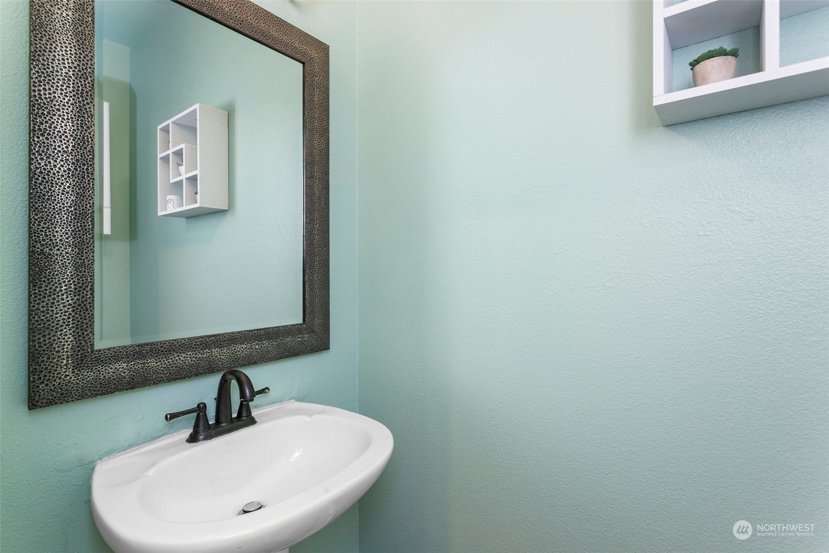 18930 Bothell Everett Highway, Unit J105 Bothell, WA 98012 - Photo 10 of 21 a bathroom with a sink and a mirror