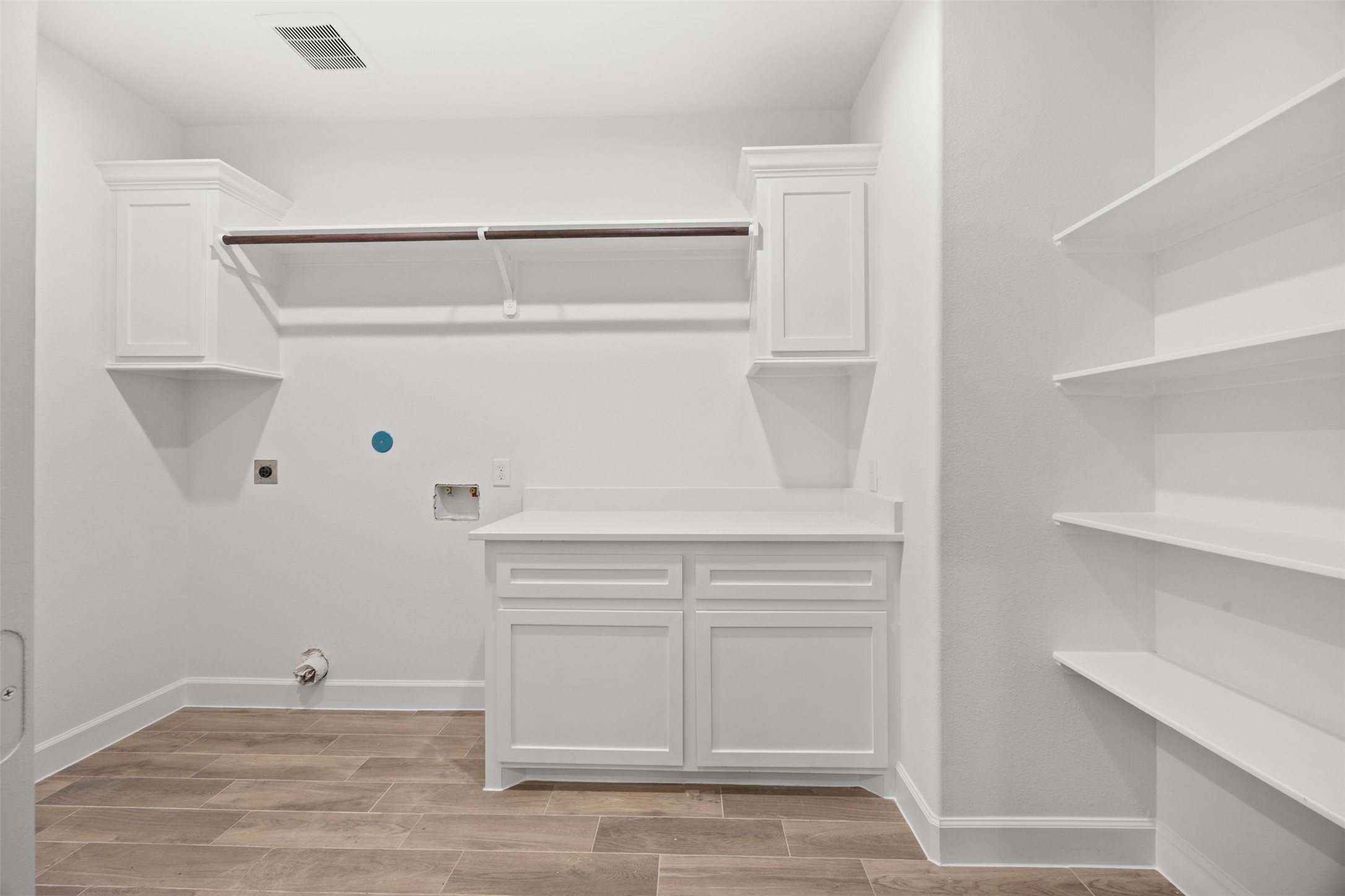 183 Windmill Road Huntsville, TX 77340 - Photo 24 of 47 Laundry room with plenty of storage and cabinets