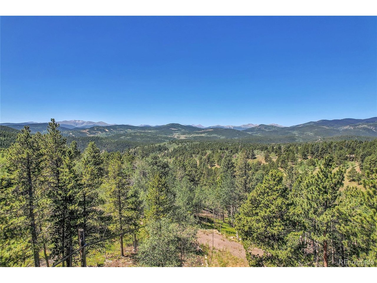 9 Hughesville Road Black Hawk, CO 80422 - Photo 10 of 17 a view of a city with lush green forest