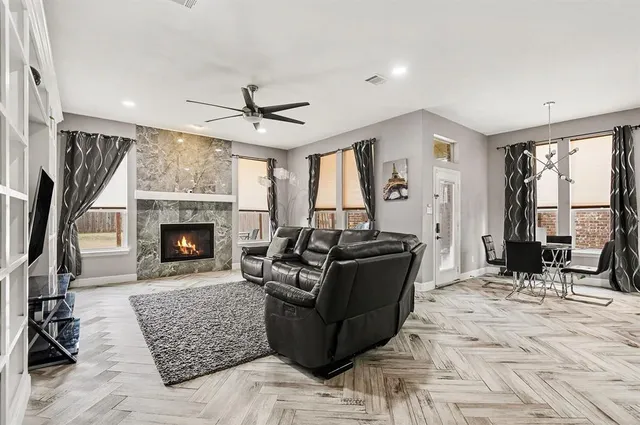 a kitchen with stainless steel appliances kitchen island granite countertop a refrigerator and microwave