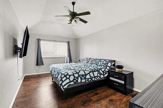 a room with furniture and wooden floor