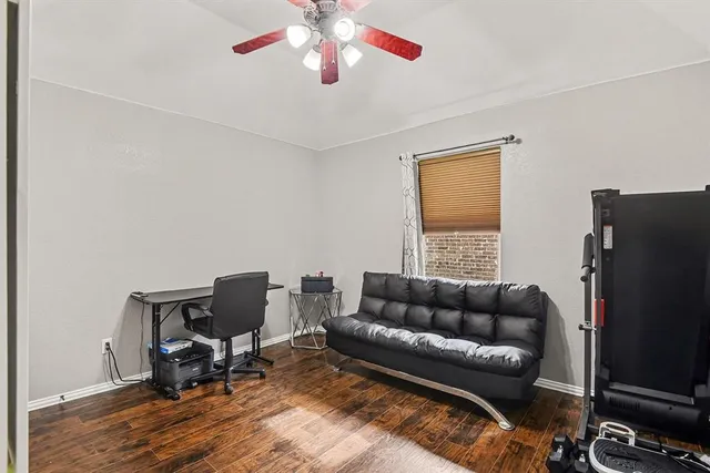 a view of a dining room with furniture and floor to ceiling window