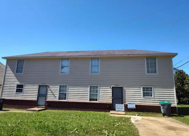 a house view with a backyard space
