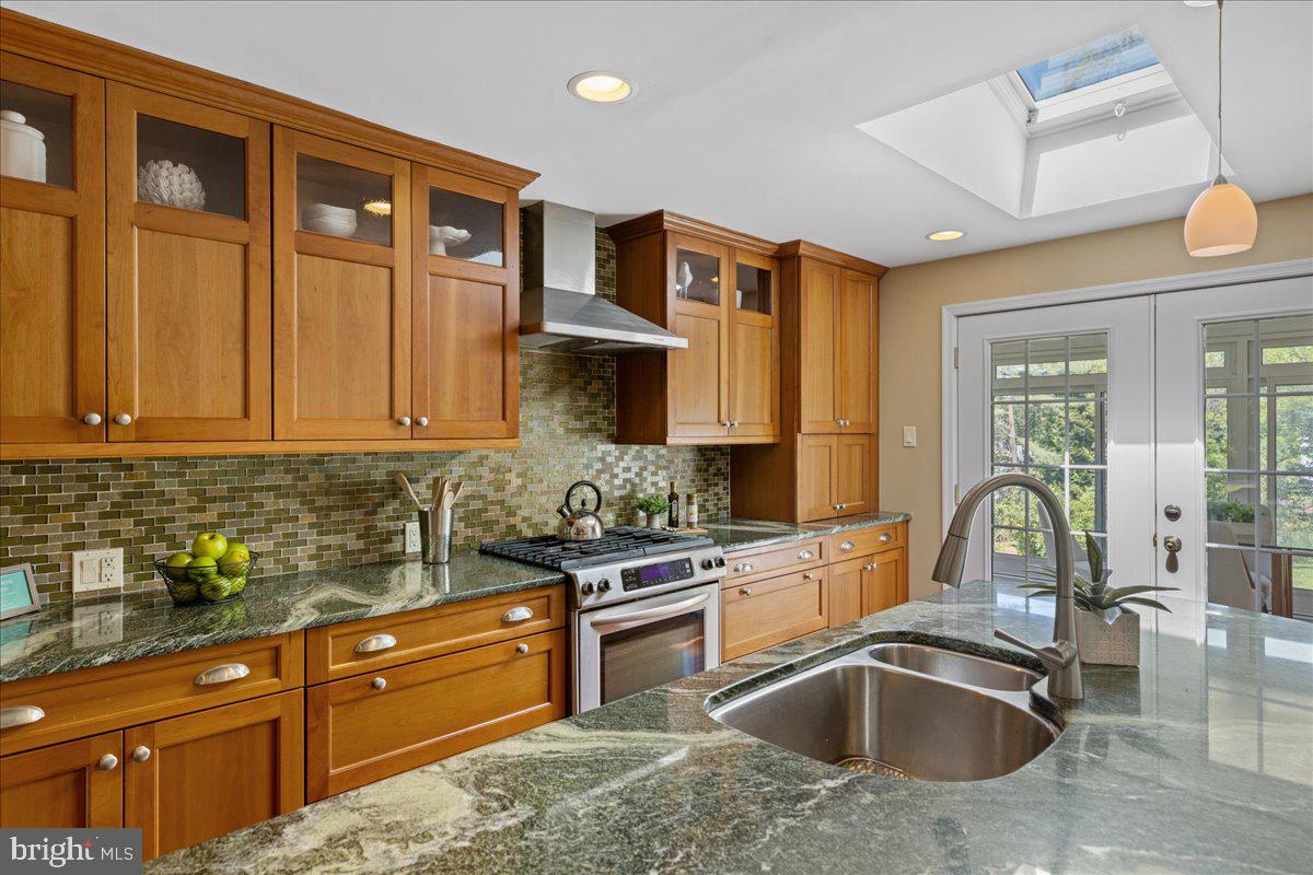 208 South Spring Mill Road Villanova, PA 19085 - Photo 10 of 40 a kitchen with granite countertop a sink and cabinets