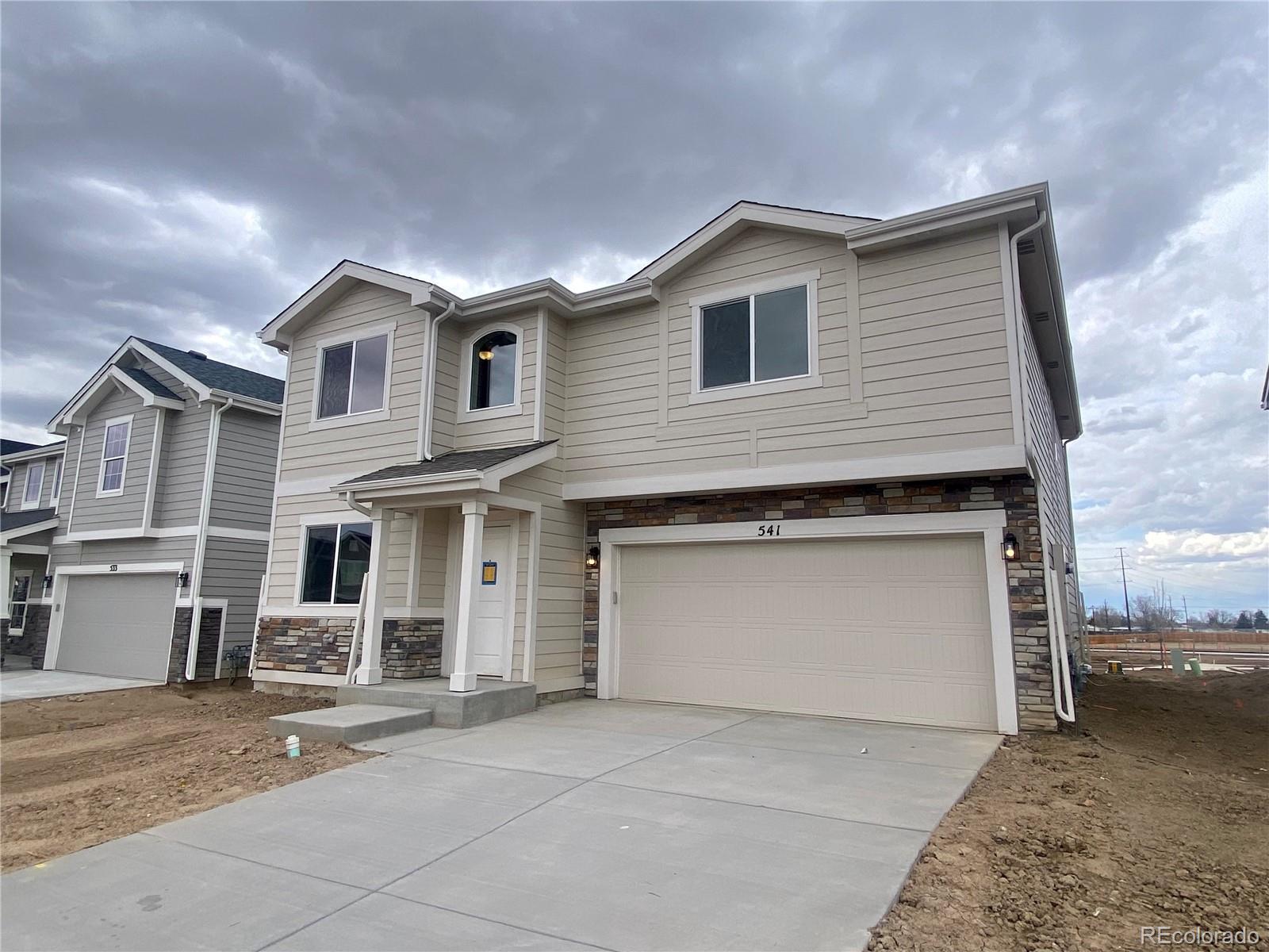 a front view of a house with a garage