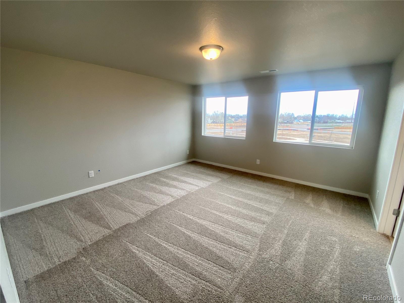 541 Ryan Avenue Fort Lupton, CO 80621 - Photo 14 of 29 an empty room with a window