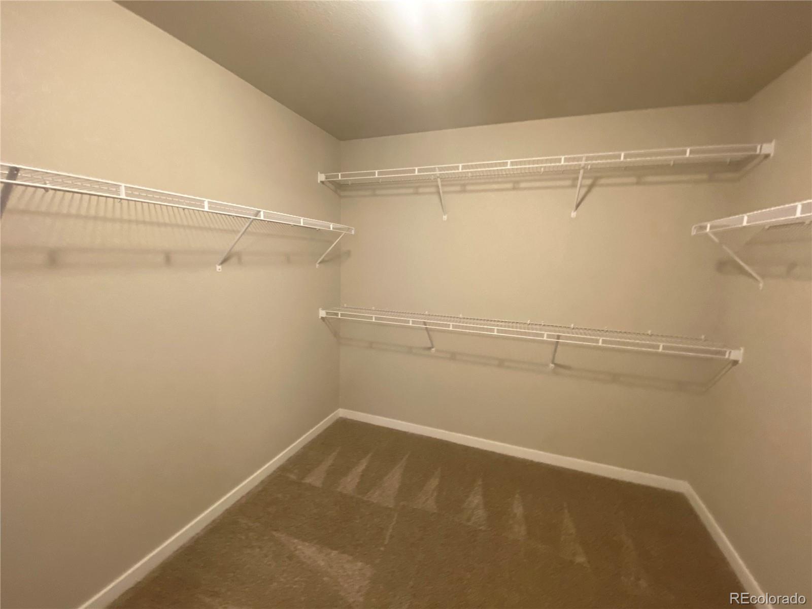 541 Ryan Avenue Fort Lupton, CO 80621 - Photo 18 of 29 a view of a room with racks on the wall