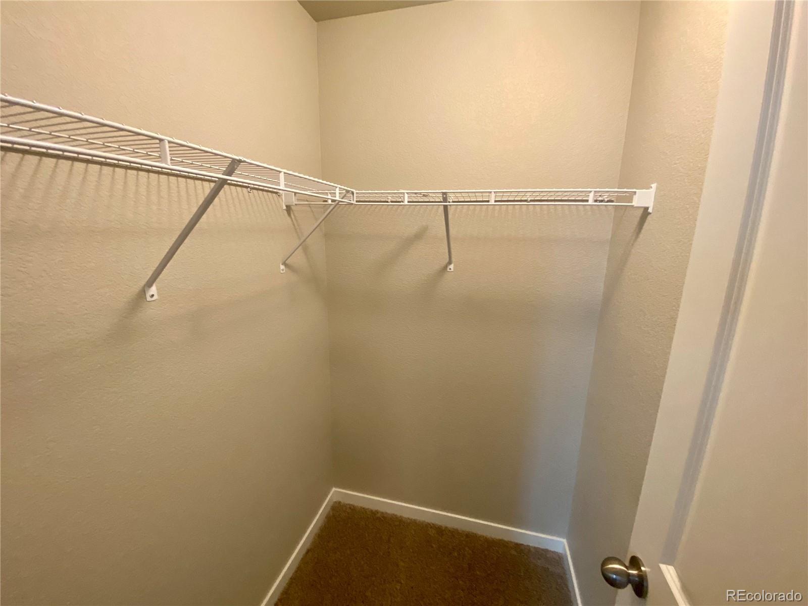 541 Ryan Avenue Fort Lupton, CO 80621 - Photo 24 of 29 a view of small space with racks on the wall