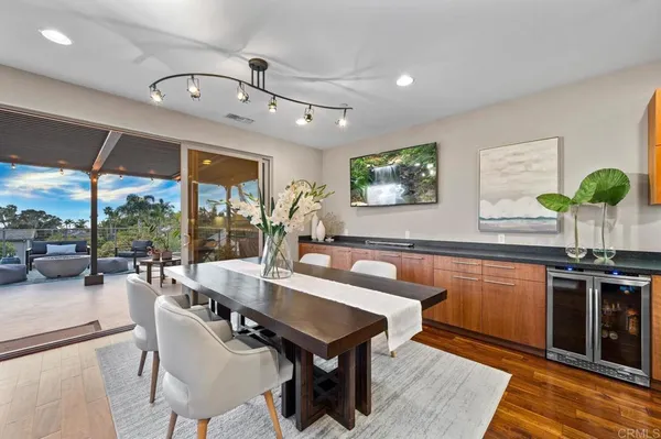 a view of a dining room with furniture window and outside view