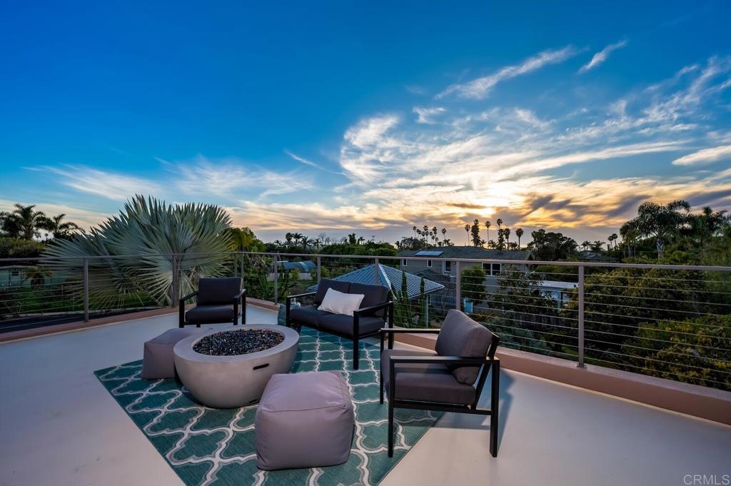 614 Ocean View Avenue Encinitas, CA 92024 - Photo 17 of 40 a view of a balcony with chairs and a potted plant