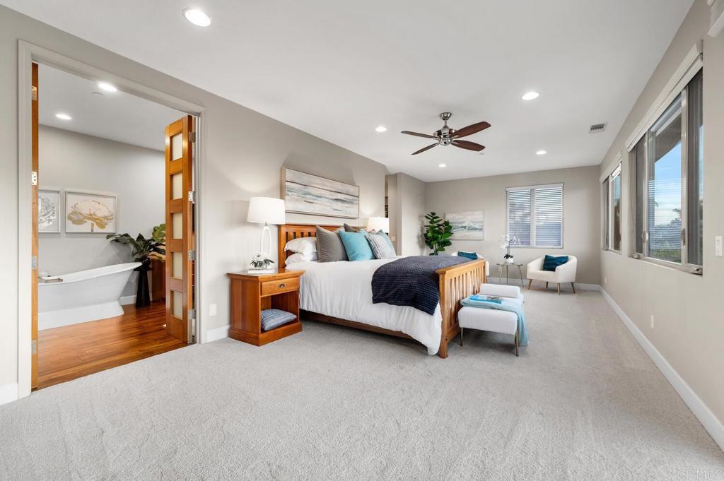 614 Ocean View Avenue Encinitas, CA 92024 - Photo 22 of 40 a bedroom with furniture and a large window