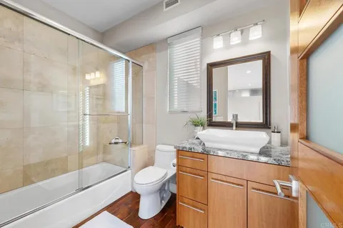 a utility room with sink dryer and washer