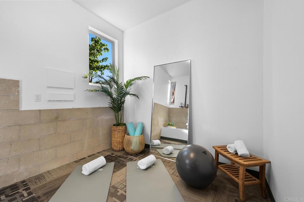 614 Ocean View Avenue Encinitas, CA 92024 - Photo 32 of 40 a living room with furniture and a potted plant