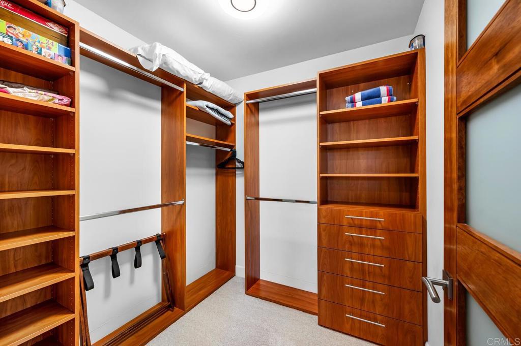 614 Ocean View Avenue Encinitas, CA 92024 - Photo 36 of 40 a view of walk in closet with empty racks