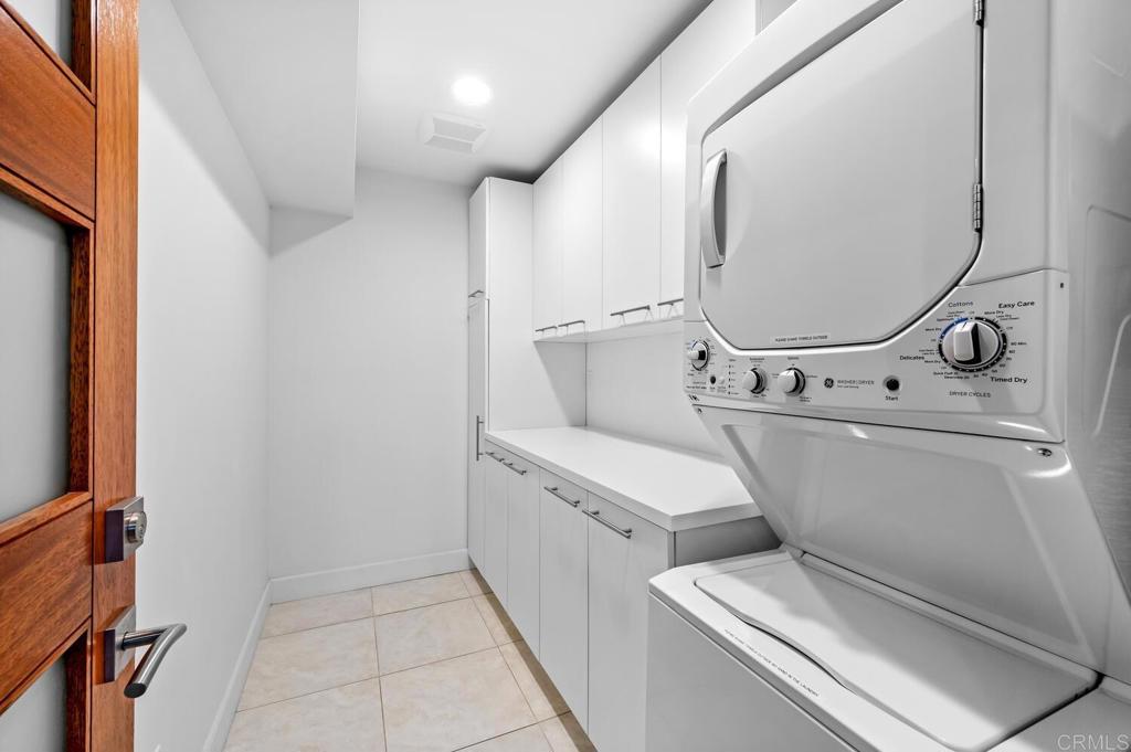 614 Ocean View Avenue Encinitas, CA 92024 - Photo 37 of 40 a utility room with dryer and washer