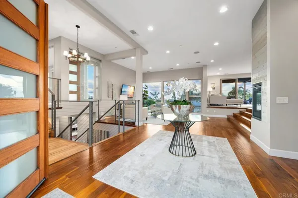 a view of a dining room with furniture wooden floor and a large window