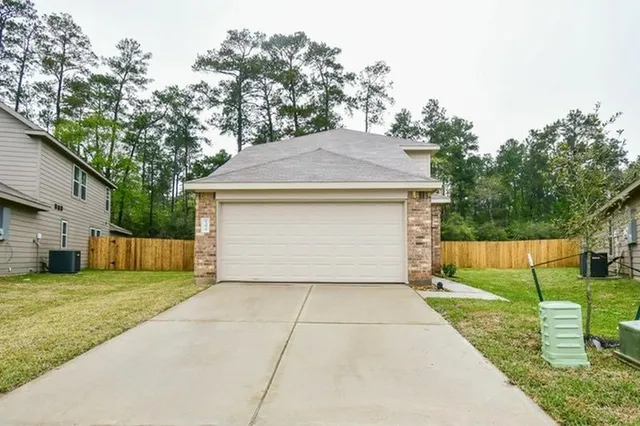 a view of a yard with potted plants