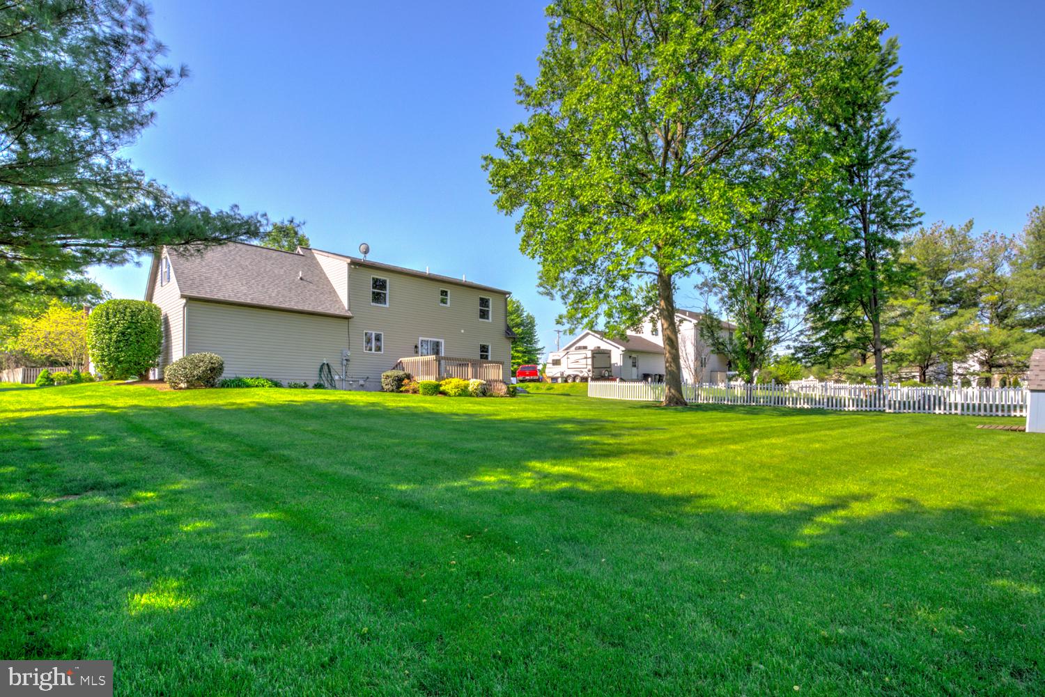 706 Rosemont Drive Lititz, PA 17543 - Photo 9 of 42 Spacious backyard with lush greenery.
