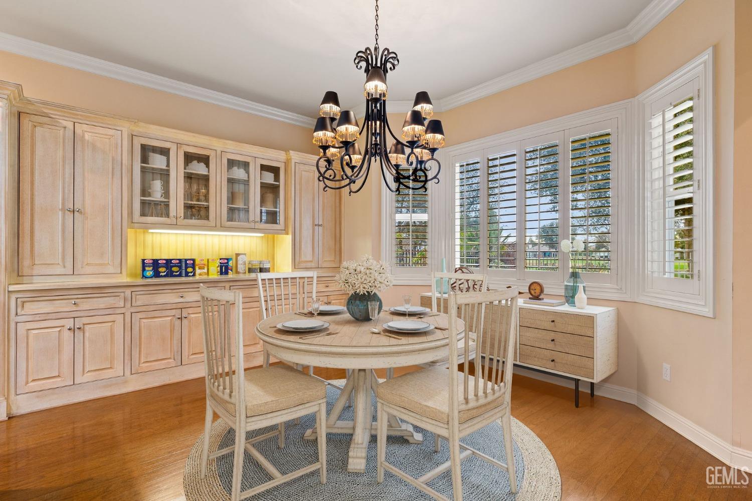 Undisclosed Address Bakersfield, CA 93311 - Photo 26 of 74 a dining room with wooden floor and large windows