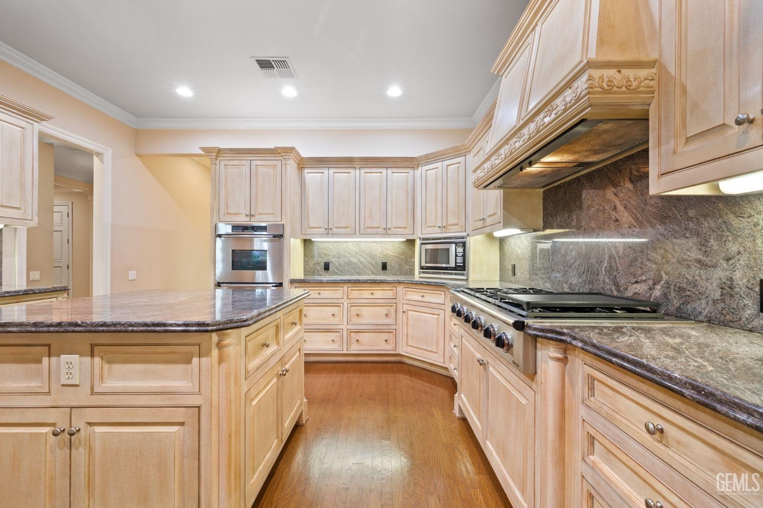 Undisclosed Address Bakersfield, CA 93311 - Photo 29 of 74 a kitchen with stainless steel appliances granite countertop a stove and a sink
