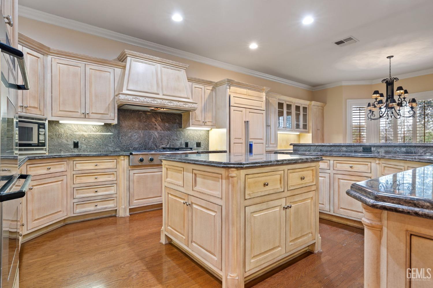 Undisclosed Address Bakersfield, CA 93311 - Photo 31 of 74 a kitchen with granite countertop white cabinets and white appliances