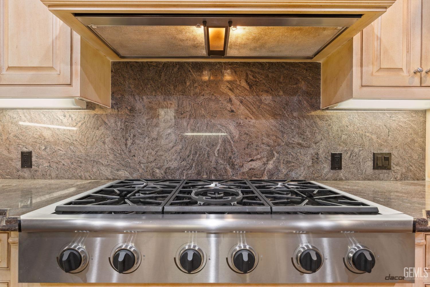 Undisclosed Address Bakersfield, CA 93311 - Photo 35 of 74 a stove sitting inside of a kitchen
