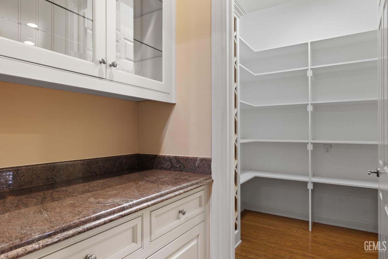 Undisclosed Address Bakersfield, CA 93311 - Photo 36 of 74 a view of storage and utility room with wooden floor