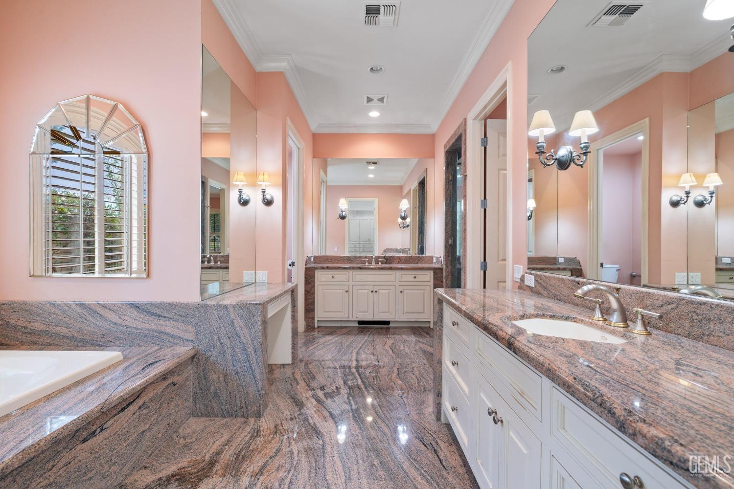 Undisclosed Address Bakersfield, CA 93311 - Photo 44 of 74 a spacious bathroom with a granite countertop sink mirror and a bathtub