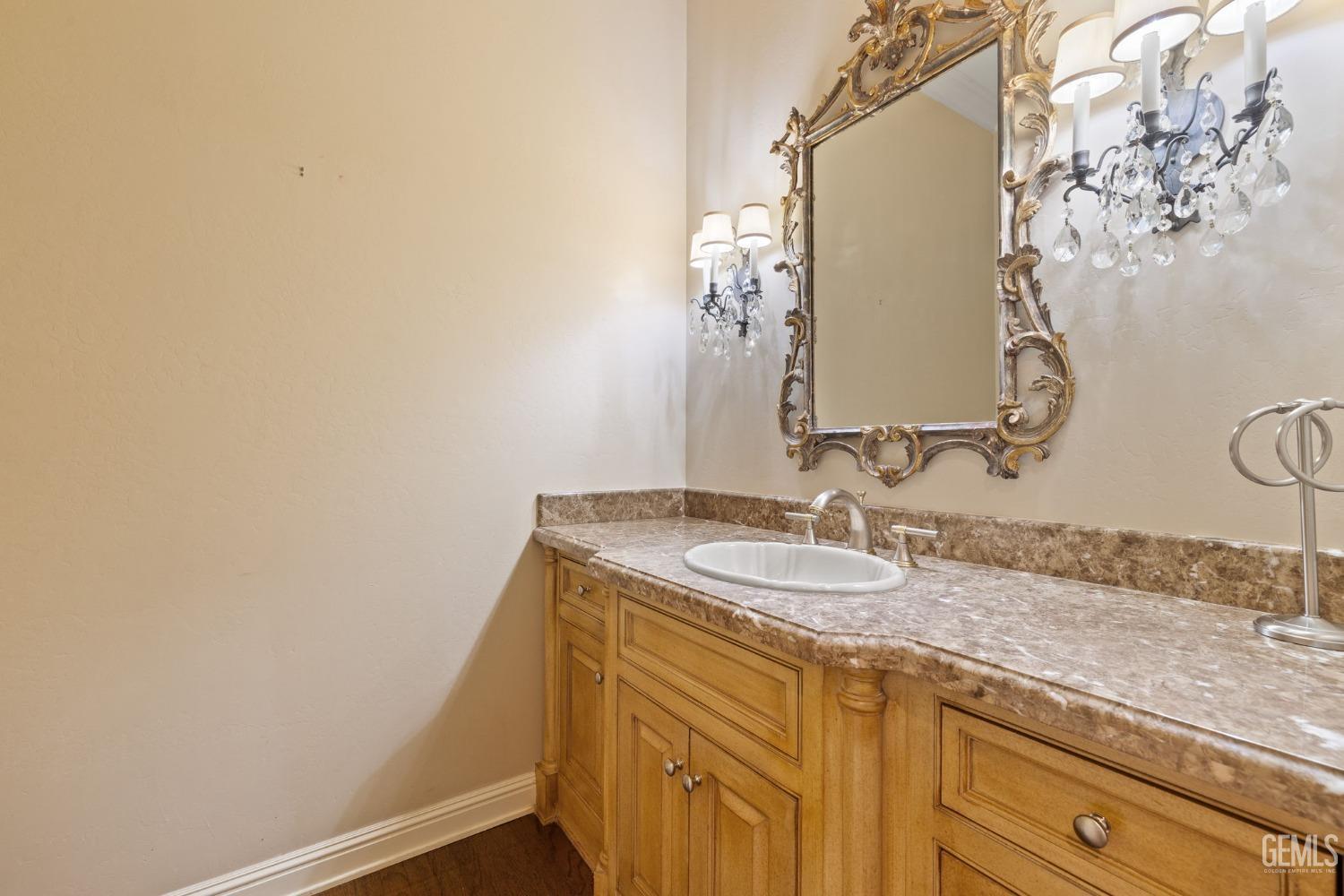 Undisclosed Address Bakersfield, CA 93311 - Photo 60 of 74 a bathroom with a sink and a mirror