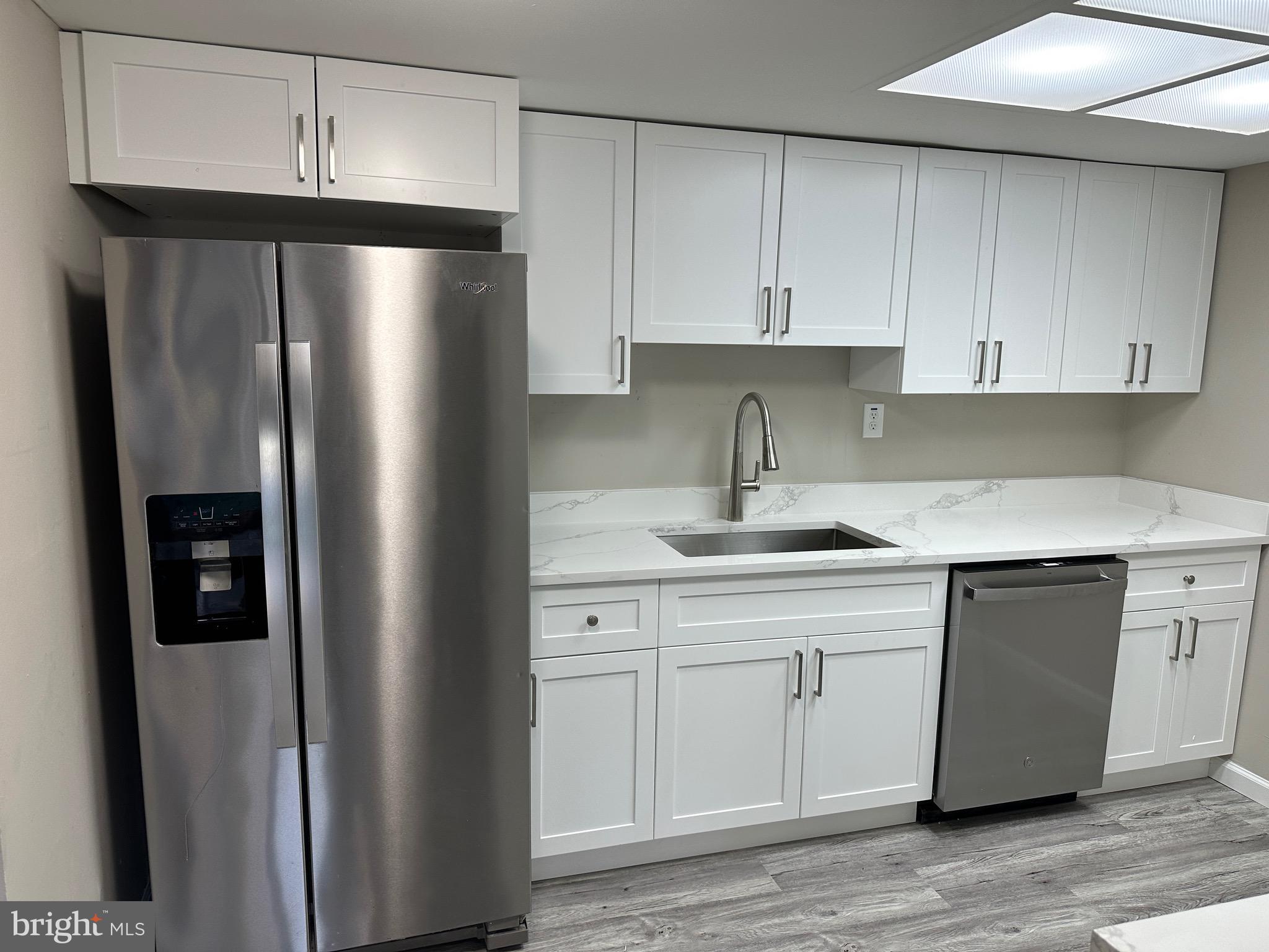 2 Ruscombe Court Willingboro, NJ 08046 - Photo 14 of 18 a kitchen with a refrigerator sink and cabinets