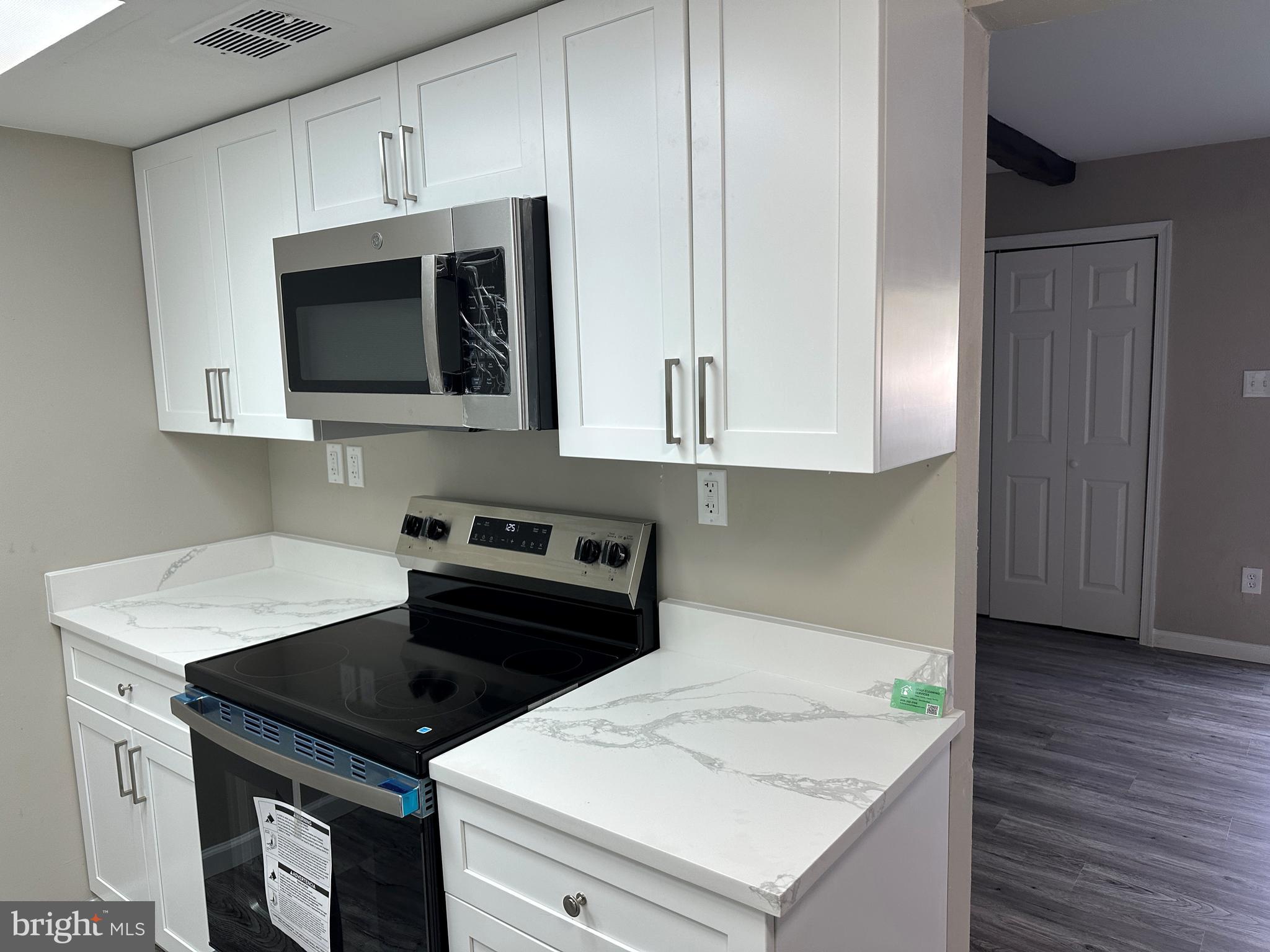 2 Ruscombe Court Willingboro, NJ 08046 - Photo 5 of 18 a kitchen with sink cabinets and microwave